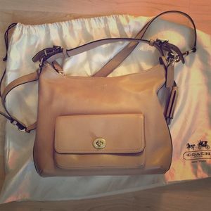 Barely used, beige leather coach purse.